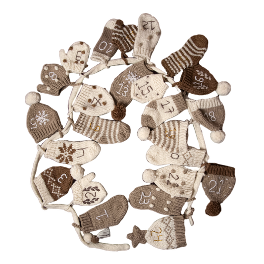 Cream wool Advent Calendar featuring 24 unique mittens, hats, and socks with hand-embroidered numbers, displayed alone.