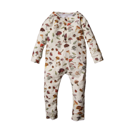 A cream-colored baby romper decorated with a whimsical mushroom print is displayed on a transparent background.