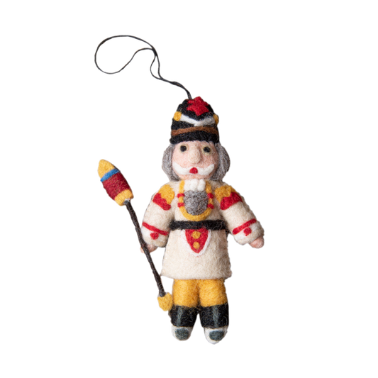 Nutcracker ornament in cream with intricate embroidery and whimsical details