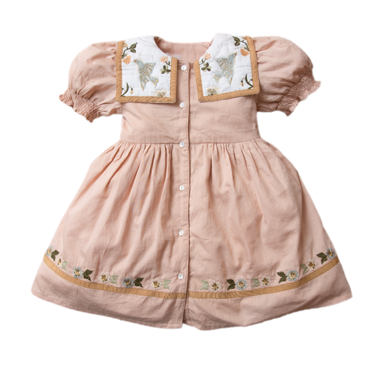 Birdie Bliss dress in Apricot with bird and floral embroidery on the collar.







