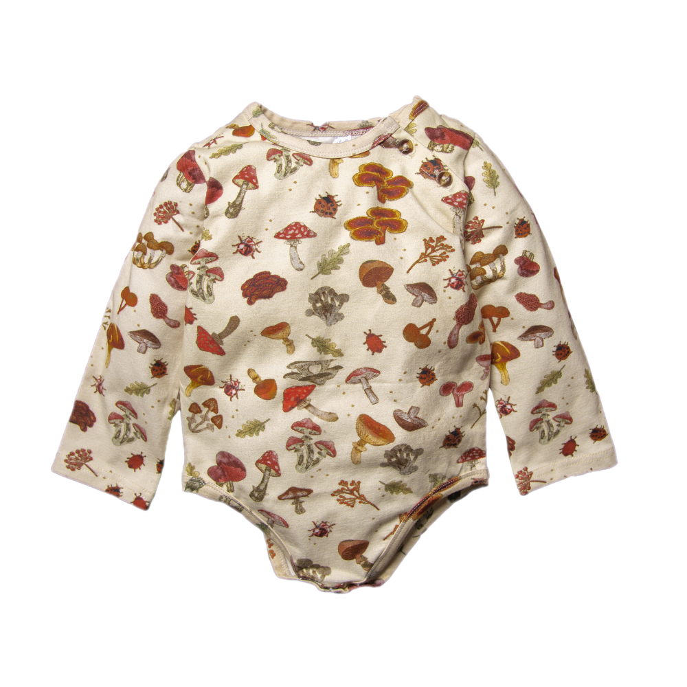 A cream long-sleeve baby bodysuit decorated with a whimsical mushroom print.