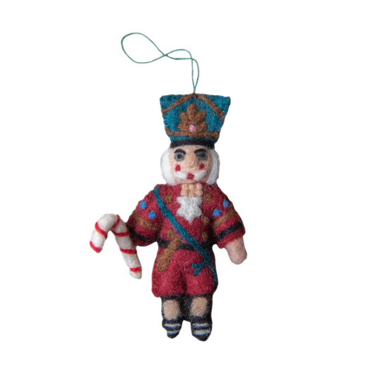 Nutcracker ornament in red with intricate embroidery and whimsical details