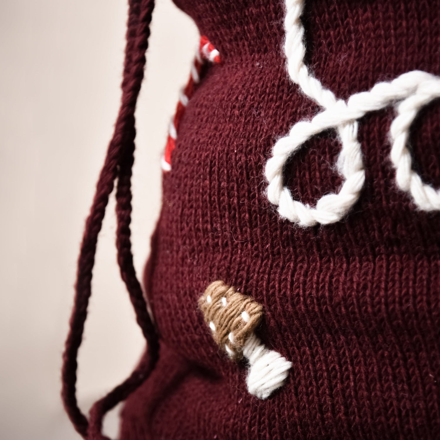 Close-up of a section of the red wool Santa sack, highlighting the quality of the material and embroidery.