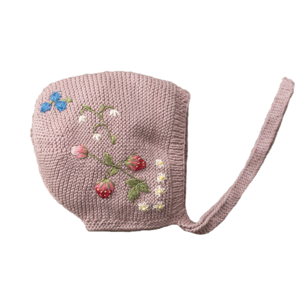 Pink knitted baby bonnet with embroidered flowers and strawberries
