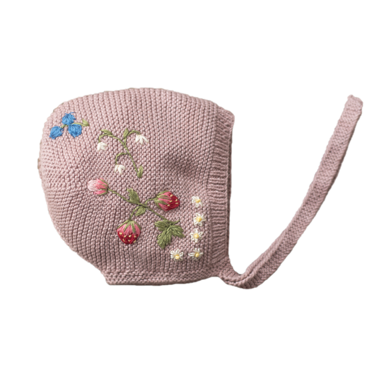 Pink knitted baby bonnet with embroidered flowers and strawberries
